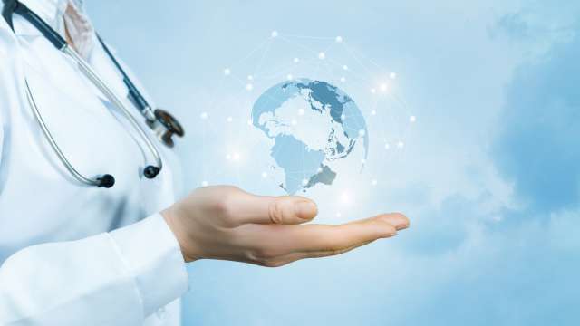 Female doctor holding a virtual globe