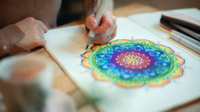 Woman drawing a geometric shape