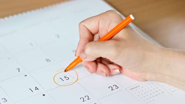 Wlman marking her calendar