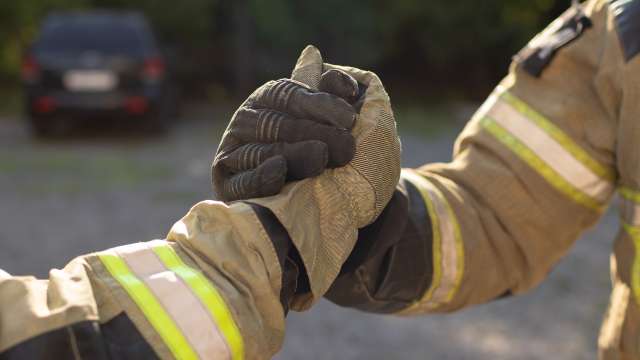 Los Angeles fireman shaking hands