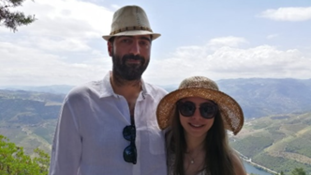 Aline Toukhtarian, MD, and her husband with a mountain background.