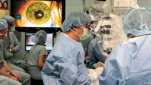 a group of surgeons performing a procedure at the Stein Eye Institute