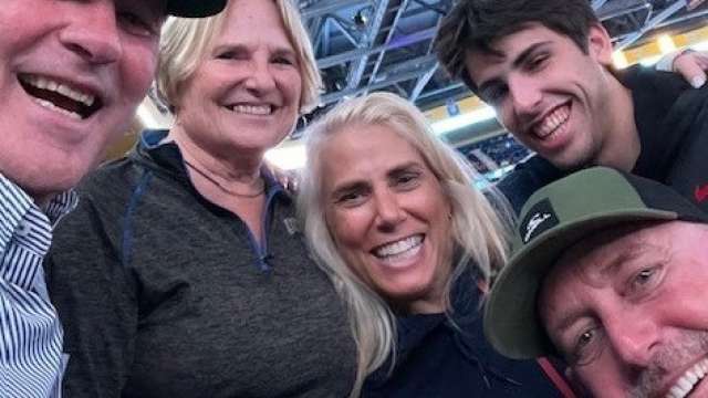 Operation Mend Buddy Family smiling together at a sporting event.