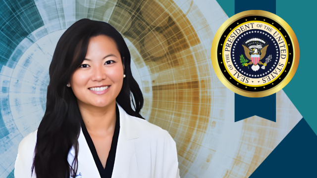 Portrait of a female doctor in a white coat with the U.S. presidential seal in the background.