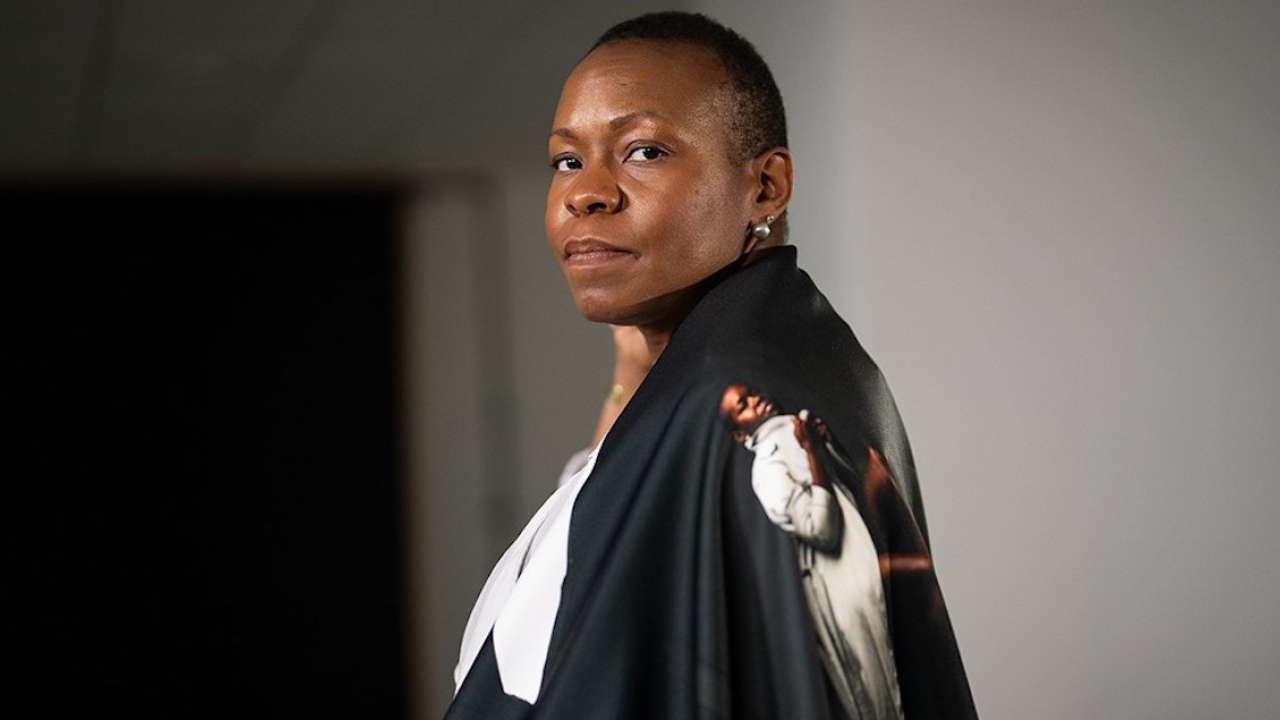 Woman wearing black cape