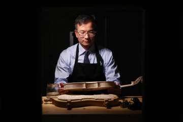When he's not studying the brain, neursurgeon Dr. Daniel Lu is crafting world-class violins. (Photo by Anne Johansson)