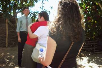 Dr. Elizabeth S. Barnert, right, observes a family reunion between a transnational adoptee, Angela, and her biological mother and brother in rural El Salvador. (Photo courtesy of Elizabeth S. Barnert)