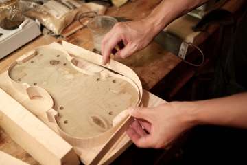 When he's not studying the brain, neursurgeon Dr. Daniel Lu is crafting world-class violins. (Photo by Anne Johansson)