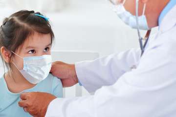 Doctor Examining hispanic female child