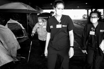 Dr. Mary M. Marfisee, left, social worker Brittany Jasker and nurse Nancy Vega visit an encampment. (Photo by Ara Oshagan)