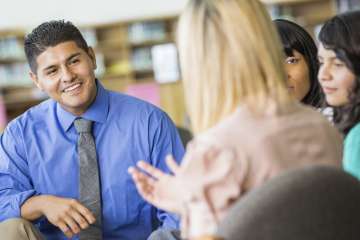 A psychiatrist talking to a group of people.