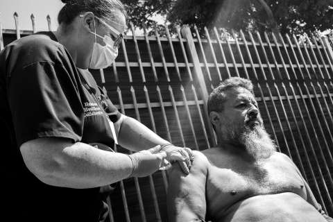  Nurse Kendal M. Wilkie provides care to a patient. (Photo by Ara Oshagan)