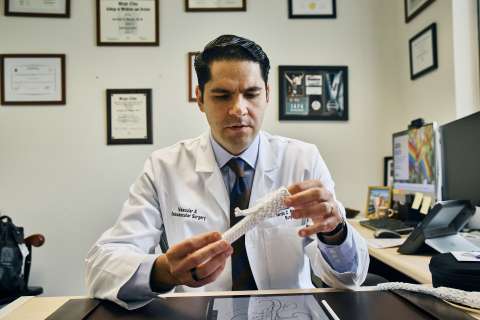 Dr. Bernardo Mendes with the branched stent graft.