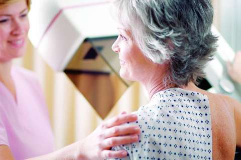 Female doctor meeting with breast cancer patient