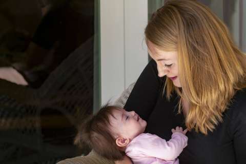 Mary Farah holding her baby, Mabel