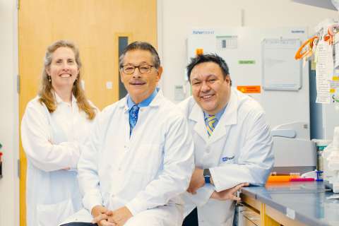 Image shows three physician-scientists in a UCLA lab. From left: Brigitte Gomperts, Donald Kohn and Steven Jonas.
