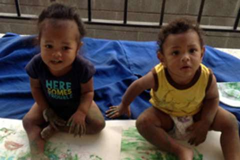 Two boys with renal disease, Dexter and Charlie, finger paint 