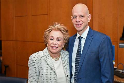 Joyce Brandman and Dr. John Belperio standing together.