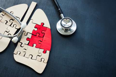 Puzzle pieces of lungs and a stethoscope