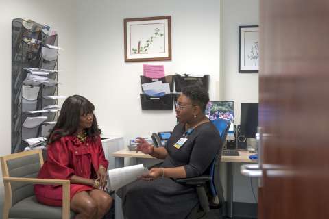 Kemi Reeves speaking with Youlanda Coleman, whose parents are enrolled in the UCLA Health Alzheimer’s and Dementia Care Program.
