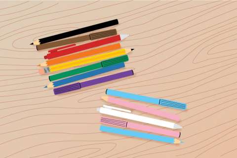 Colorful pencils arranged on a wooden surface, showcasing various hues.
