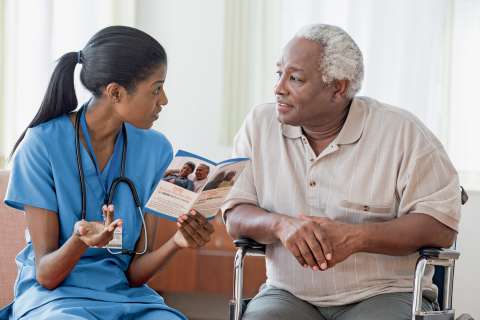 nurse and older male patient