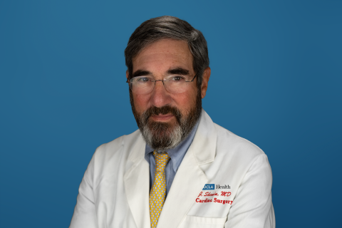 Dr. Richard J. Shemin wearing his white lab coat.