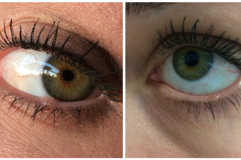 Close-up of a human eye with detailed focus on the iris, pupil, and surrounding eyelashes.