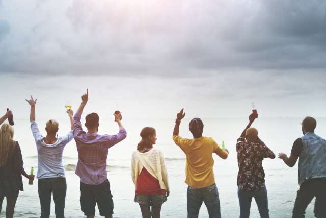Cancer patients standing together on the beach