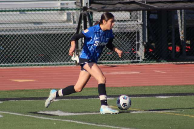 Anisa Juarez playing soccer