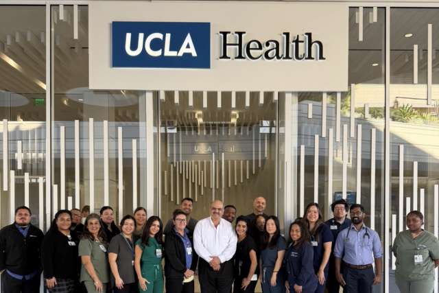 UCLA Health group of doctors and physicians and patient smiling together