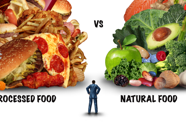 A man standing next to a pile of food