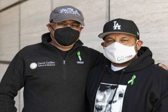 Louie Mejia and Dr. Anjay Rastogi both wearing face masks