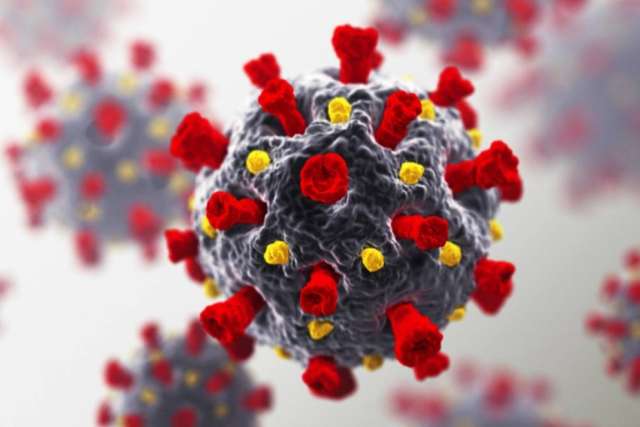 Close‑up illustration of a spherical virus with gray surface and red spike proteins, with blurred particles in the background