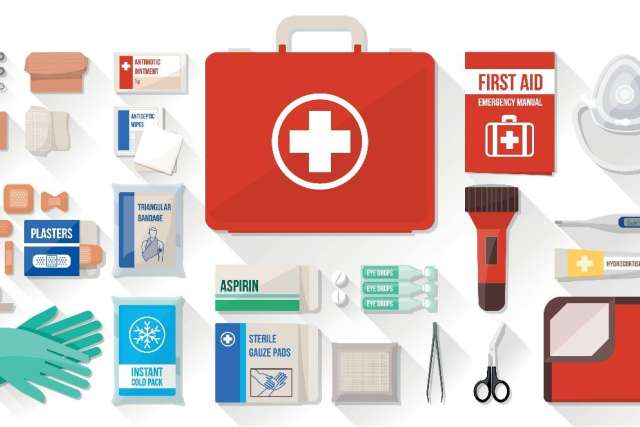 Red first aid kit with assorted medical supplies