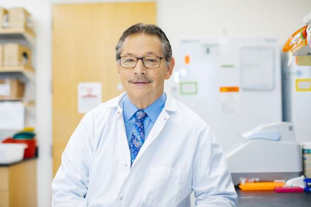 Dr. Donald Kohn smiles in a UCLA laboratory. 
