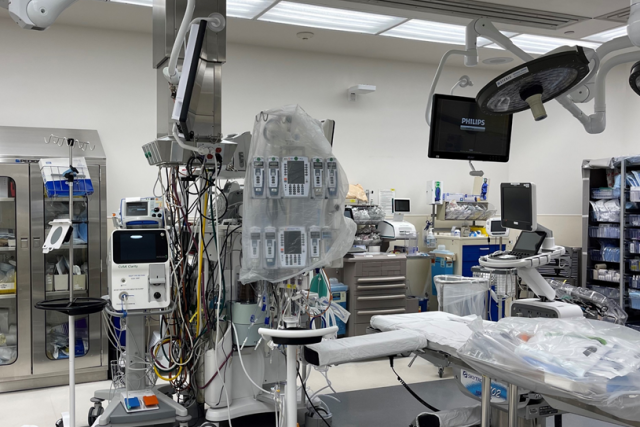 an empty operating room, filled with medical equipment.