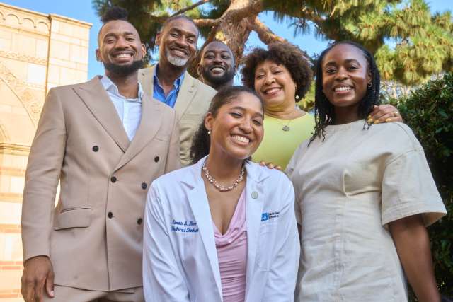Medical student and her family pose for portrait.