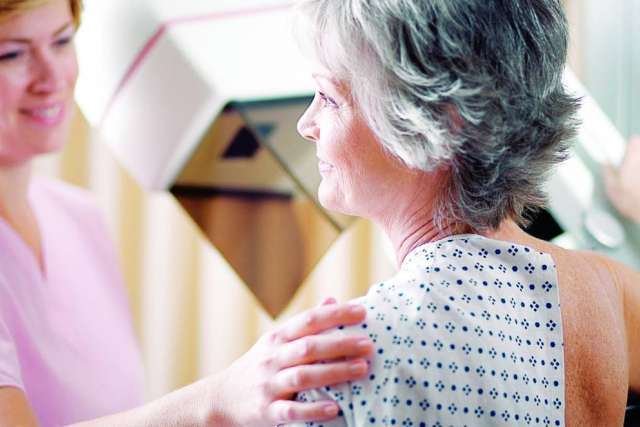 Female doctor meeting with breast cancer patient