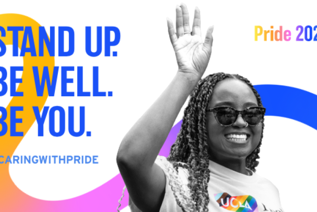 Inspirational message "Pride 2025 - Stand Up, Be Well, Be You" displayed in bold, rainbow-themed typography.