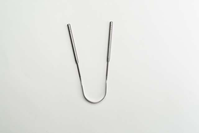 Metal U-shaped tongue scraper