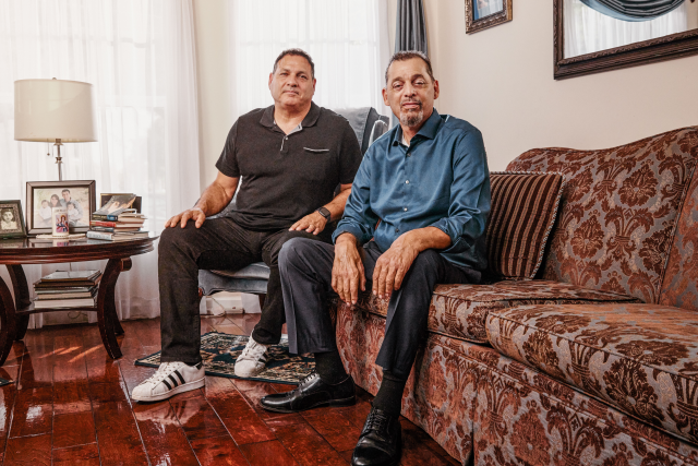 Brothers Tom and Andrew Macias seated together on their couch at home after Andrew’s kidney transplant through UCLA Health’s tolerance program.