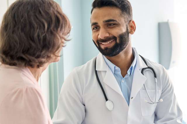 Doctor consulting with cancer patient