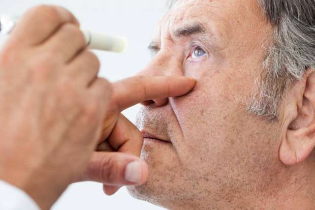 Older man receiving an eye exam