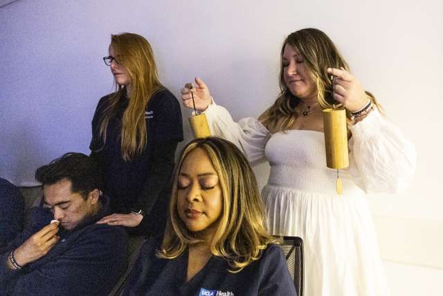 Nursing professional development specialist Kelley Anderson and clinical nurse Desiree Noel create a calming environment for nurses to relax and reset.