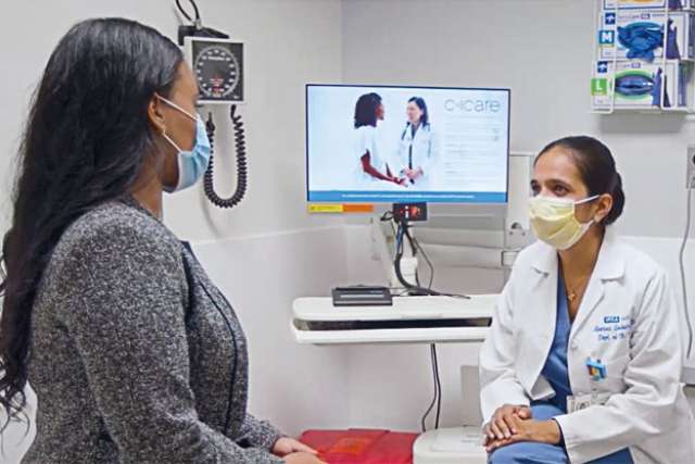 Dr. Aparna Sridhar speaks with a patient