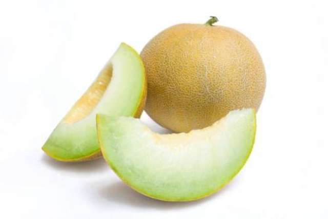 A close-up photograph of a cantaloupe with two sliced wedges on a white background.