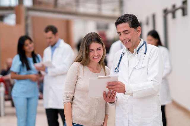 Patient and doctor looking at results