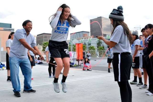 Kids playing sports on a playground