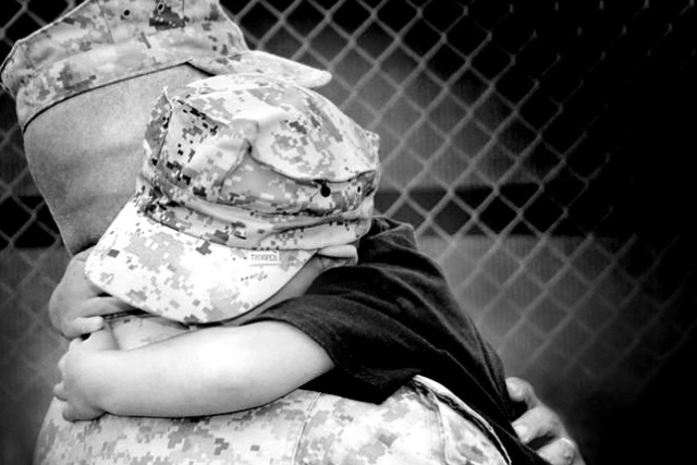 Operation Mend warrior and his child